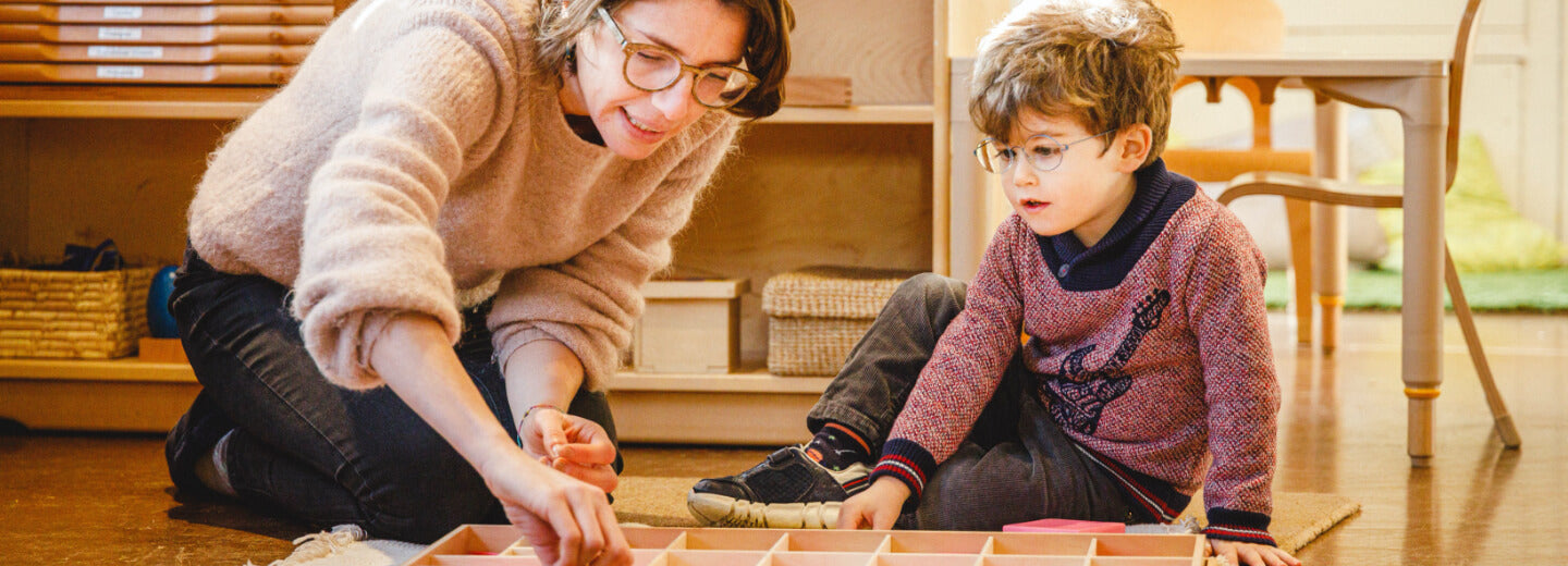 Teacher and child playing