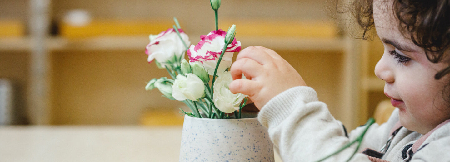 Child playing with flowers