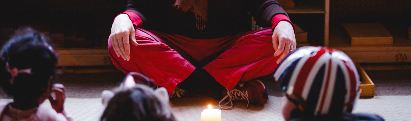 Teacher and children meditating