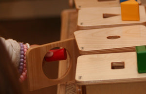 Child playing with shapes and blocks