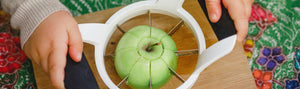 Child cutting apple
